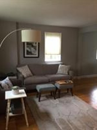 63 Linden Street, Unit 7 Wellesley, MA 02482 - Photo 6 of 11 a living room with furniture and a window