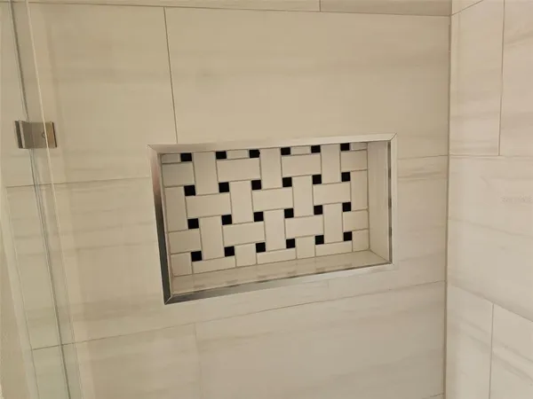 a view of a chair and tables in the patio