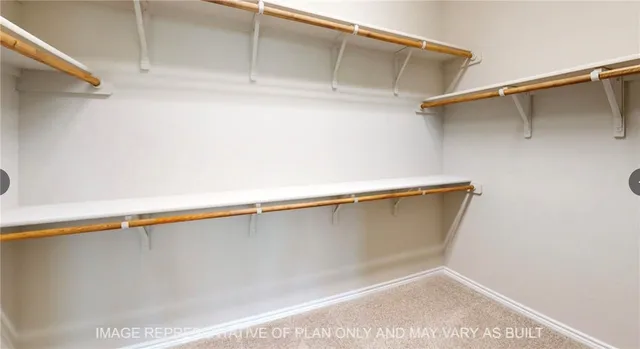 a bathroom with a tub shower and sink