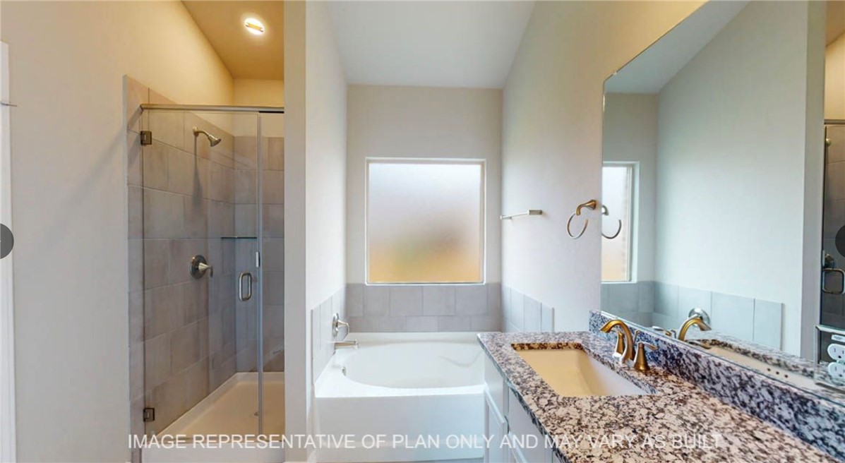 9805 Bridlewood Lane Waco, TX 76708 - Photo 14 of 35 a bathroom with a tub shower and sink