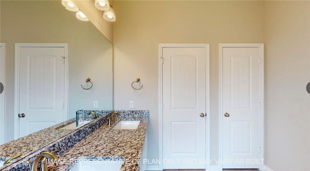 9805 Bridlewood Lane Waco, TX 76708 - Photo 15 of 35 a bathroom with a granite countertop sink a mirror and shower