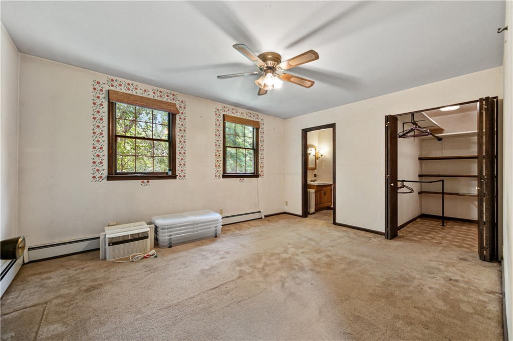 237 Leslie Road Valencia, PA 16059 - Photo 13 of 29 an empty room with windows and ceiling fan