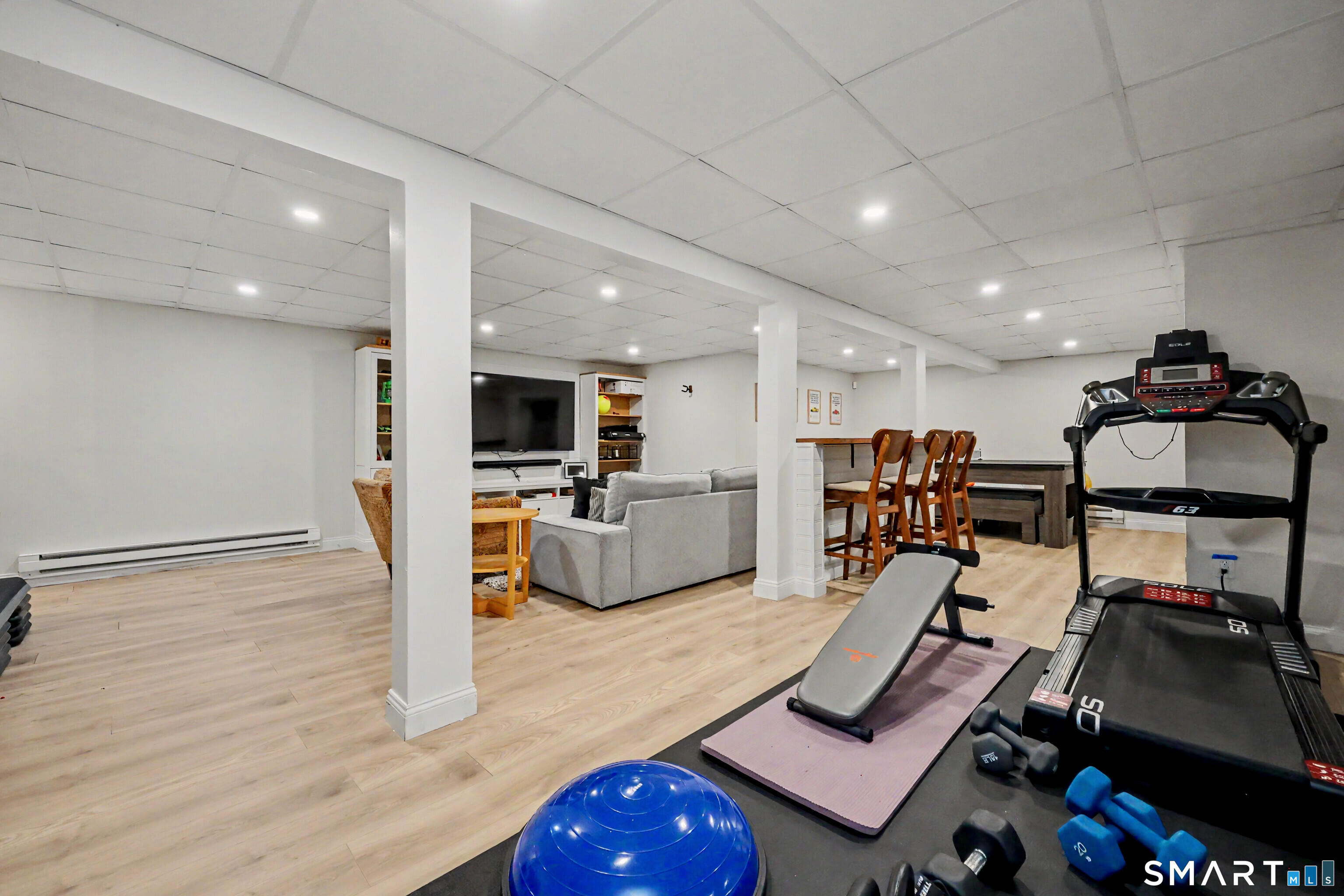 241 Mountain Road Wilton, CT 06897 - Photo 23 of 32 Remodeled Lower Level Adds Valuable Living Space with Dedicated Home Workout Area and Ping Pong Table