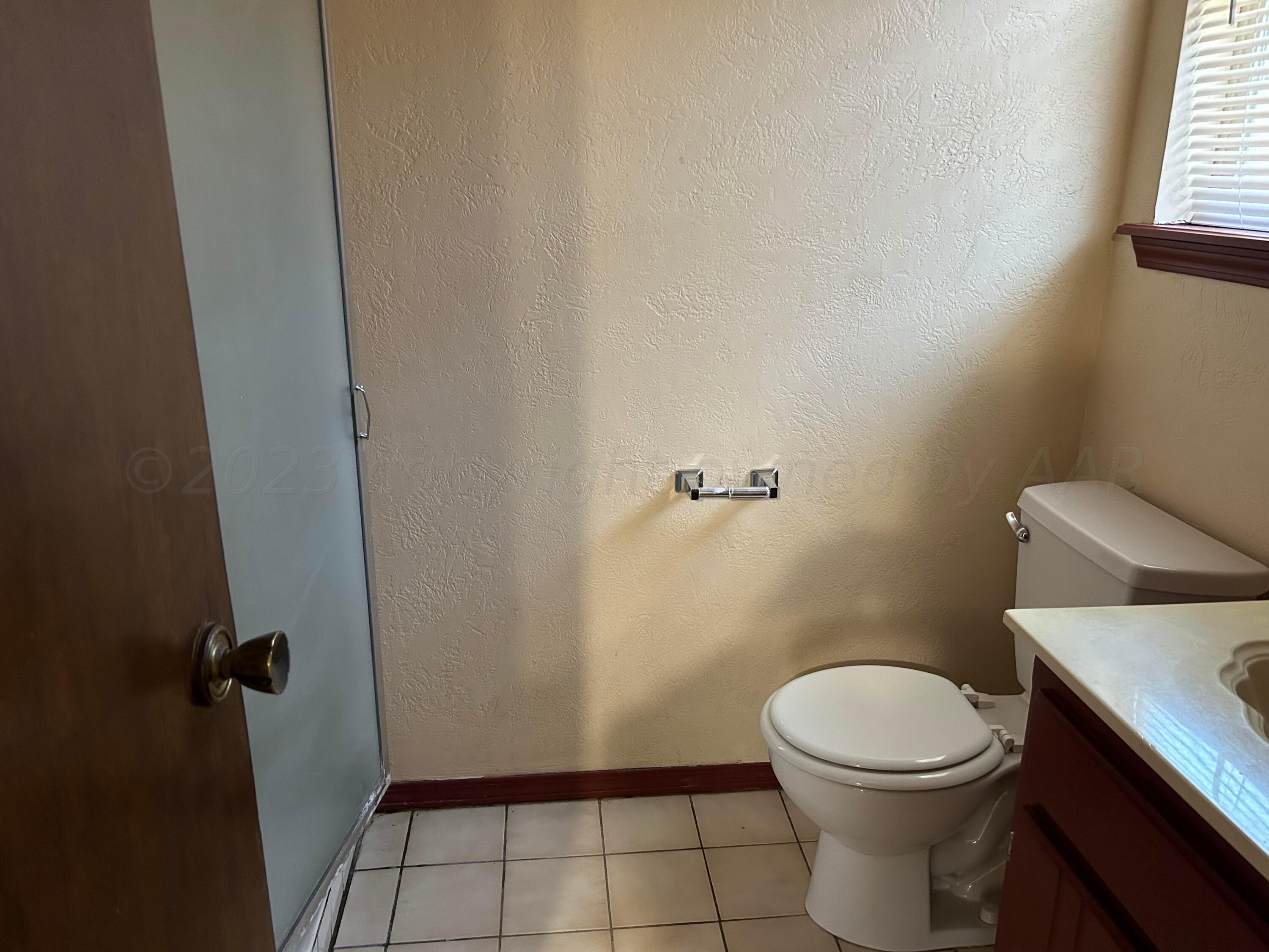 5321 Capulin Lane Amarillo, TX 79110 - Photo 10 of 16 a bathroom with a toilet