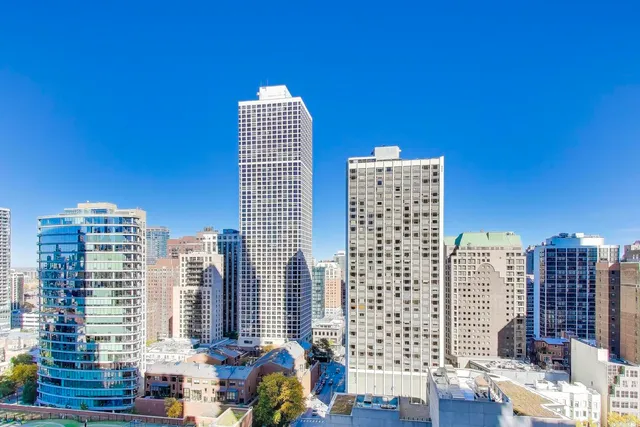 a view of city with tall buildings