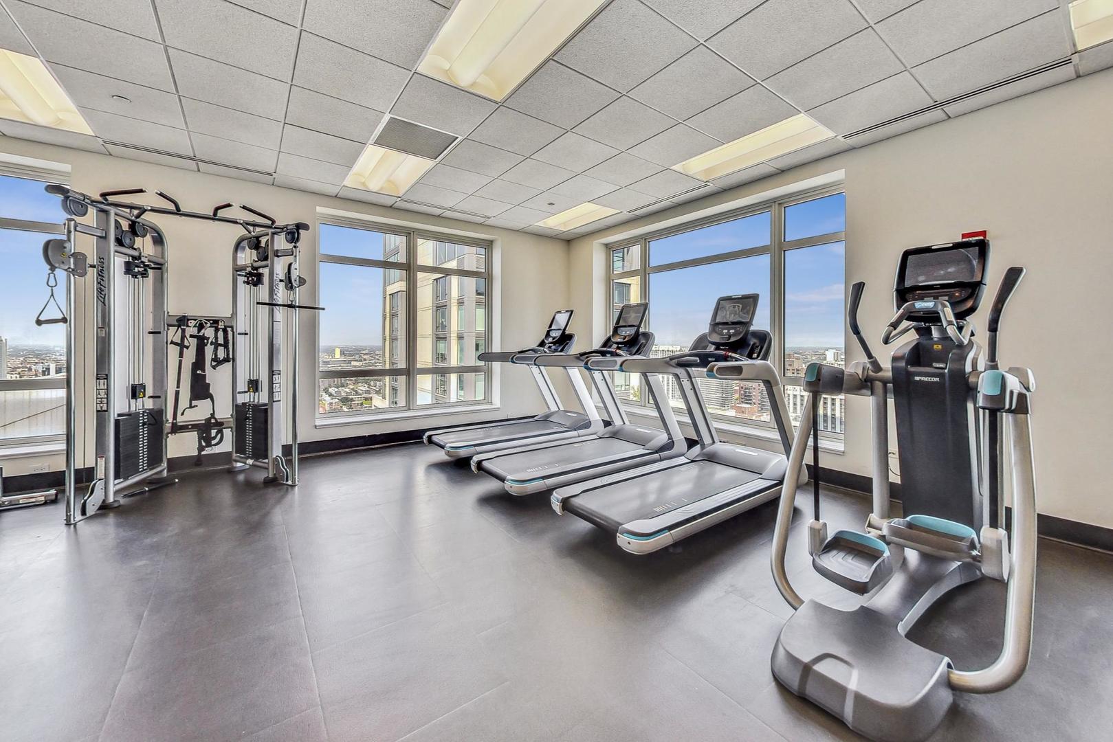 10 East Delaware Place, Unit 20A Chicago, IL 60611 - Photo 26 of 41 a bedroom with furniture and a large window