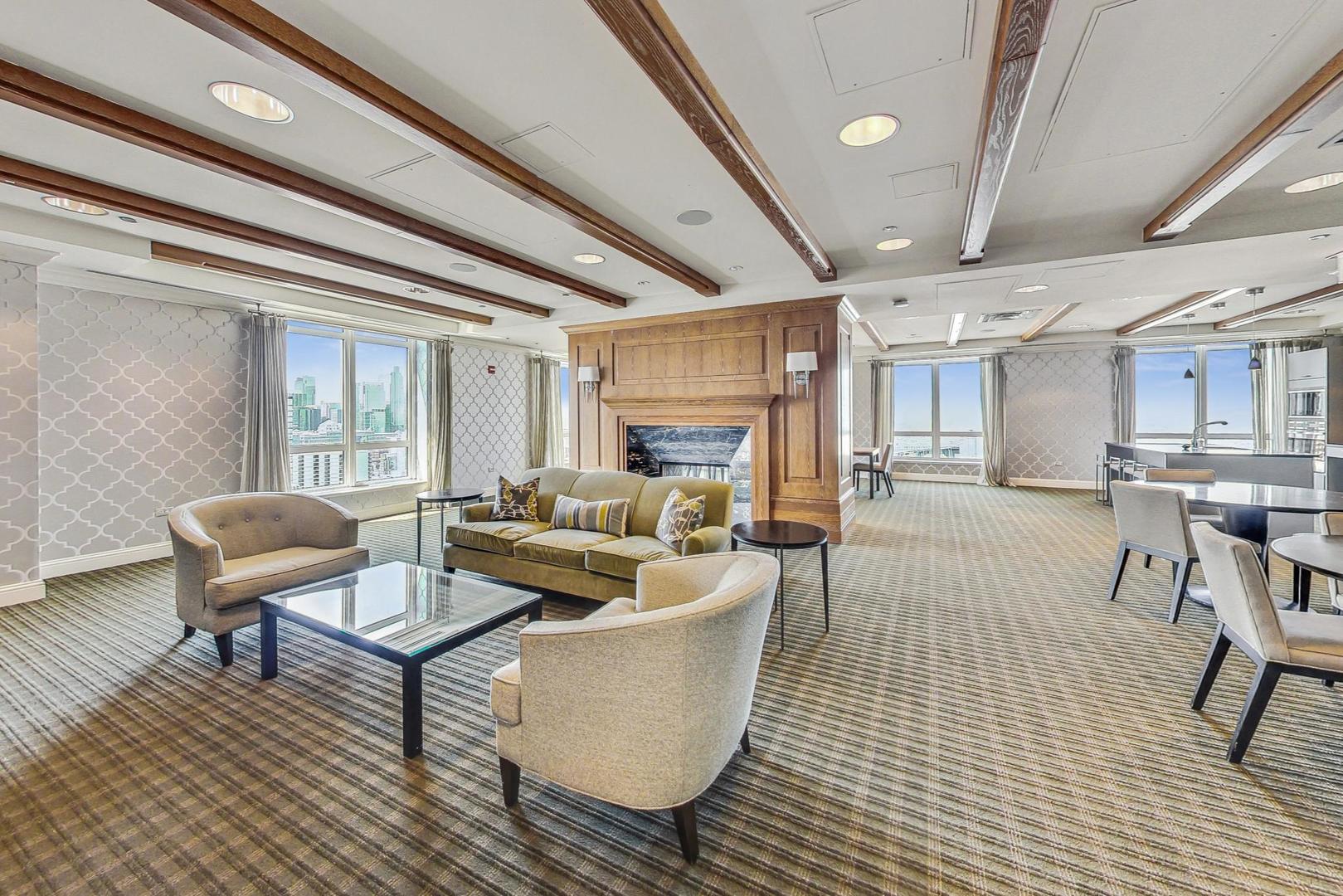 10 East Delaware Place, Unit 20A Chicago, IL 60611 - Photo 28 of 41 a living room with furniture and a fireplace