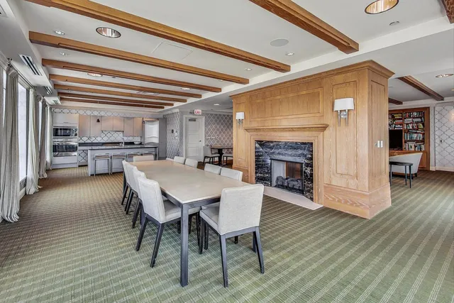 a view of a dining room with furniture wooden floor and a rug