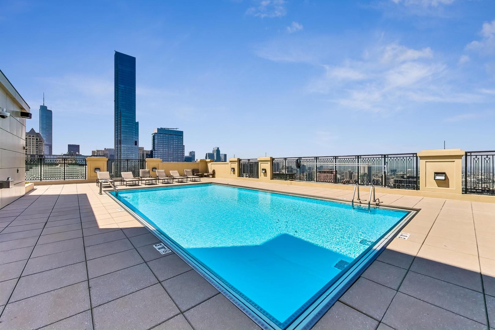 10 East Delaware Place, Unit 20A Chicago, IL 60611 - Photo 33 of 41 an outdoor space with pool and furniture