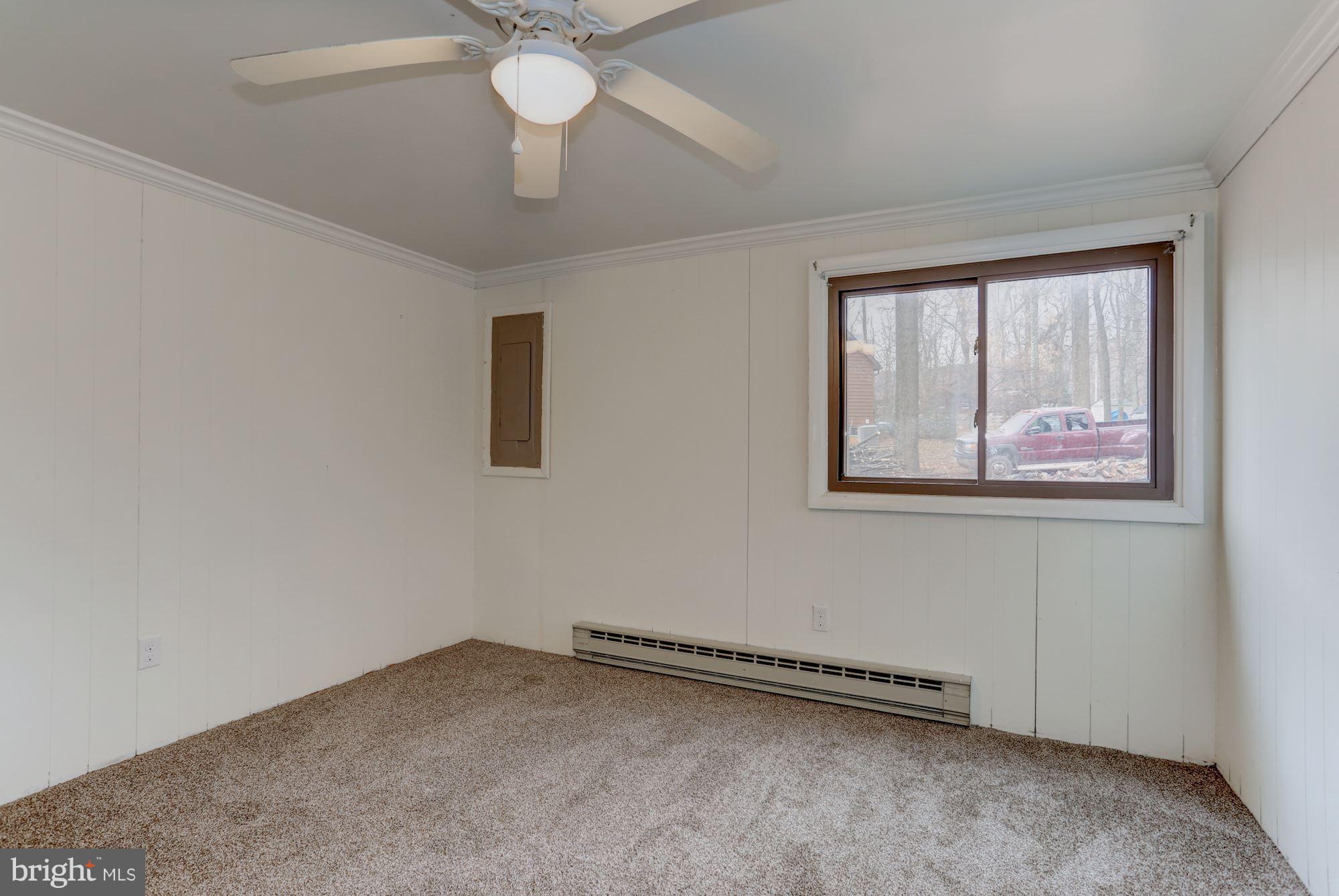 103 Club House Road Front Royal, VA 22630 - Photo 14 of 30 an empty room with windows