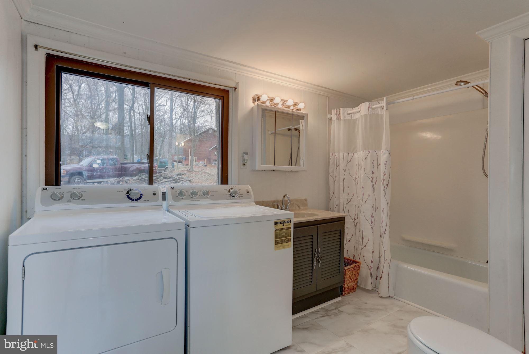 103 Club House Road Front Royal, VA 22630 - Photo 15 of 30 a view of bathroom with a tub sink and mirror