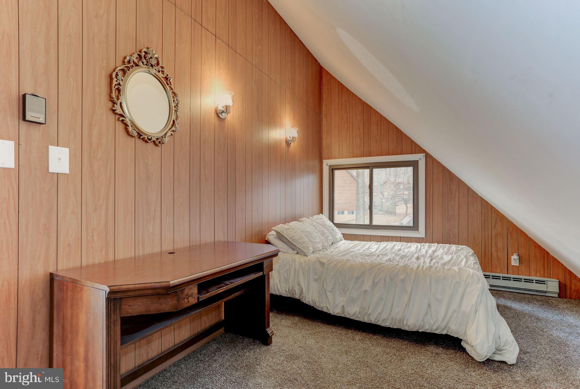 103 Club House Road Front Royal, VA 22630 - Photo 17 of 30 a bedroom with a bed and a window
