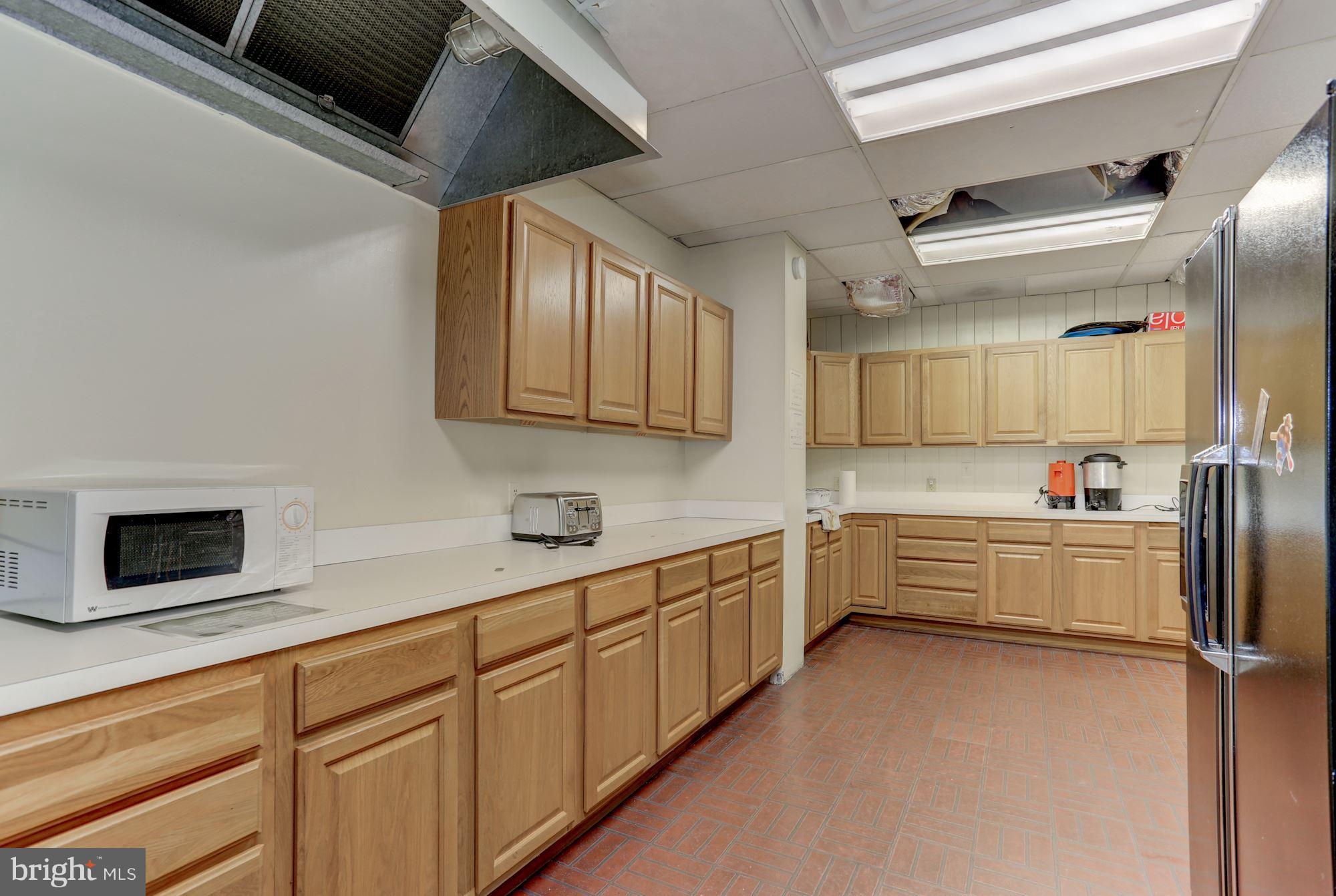 103 Club House Road Front Royal, VA 22630 - Photo 25 of 30 a kitchen with cabinets and wooden floor
