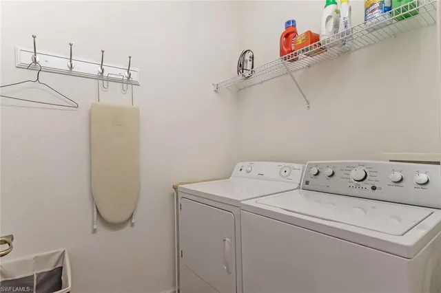 a utility room with dryer and washer
