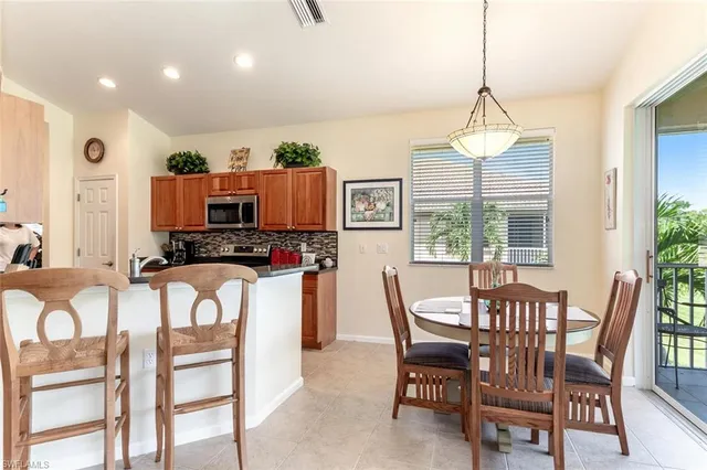 a view of a dining room with furniture window and outside view