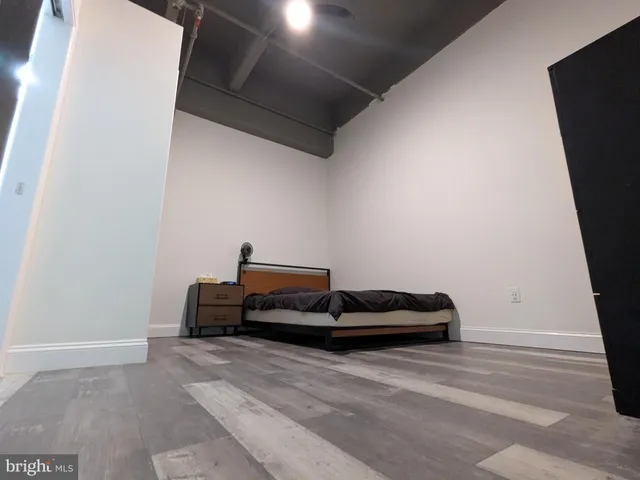 a bedroom with bed and window