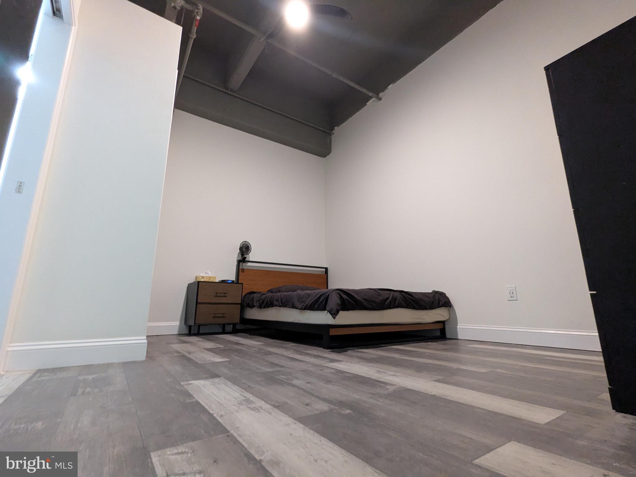 511 North Broad Street, Unit 204 Philadelphia, PA 19123 - Photo 16 of 47 a bedroom with bed and window