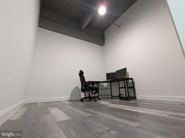 a workspace with furniture and a window