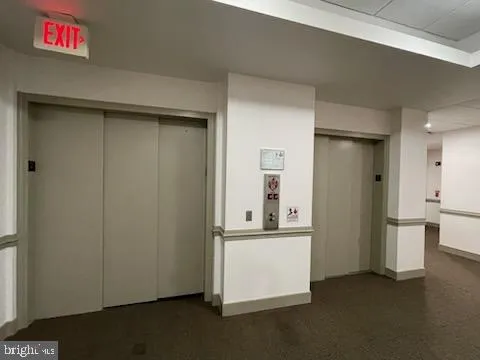a view of a kitchen with a refrigerator