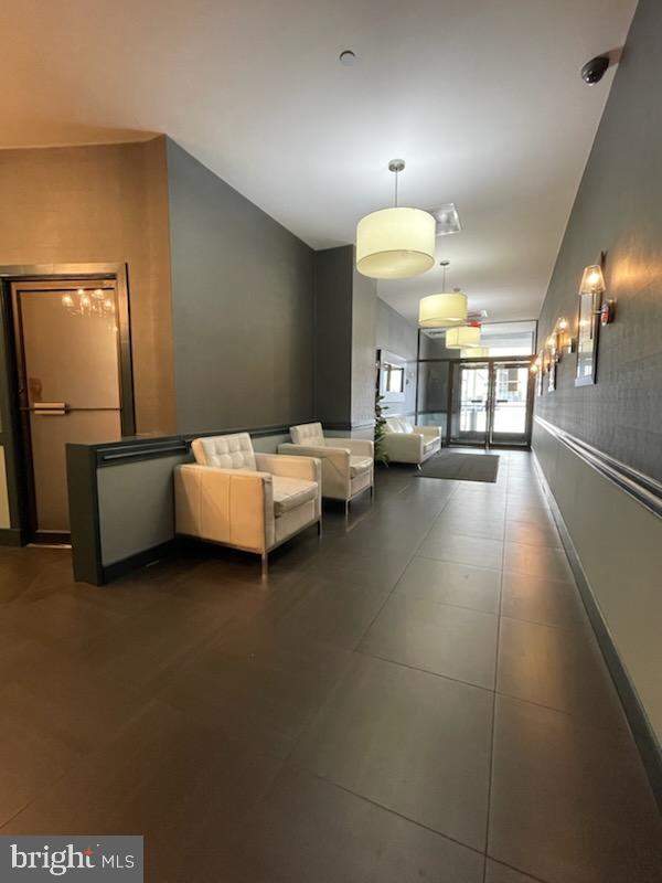 511 North Broad Street, Unit 204 Philadelphia, PA 19123 - Photo 36 of 47 a living room with a bed furniture and a potted plant