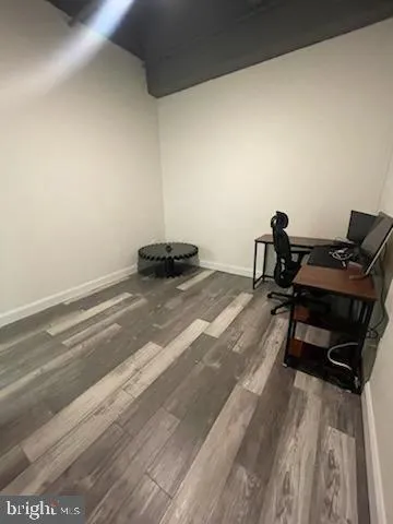 a bed sitting in a room next to a window