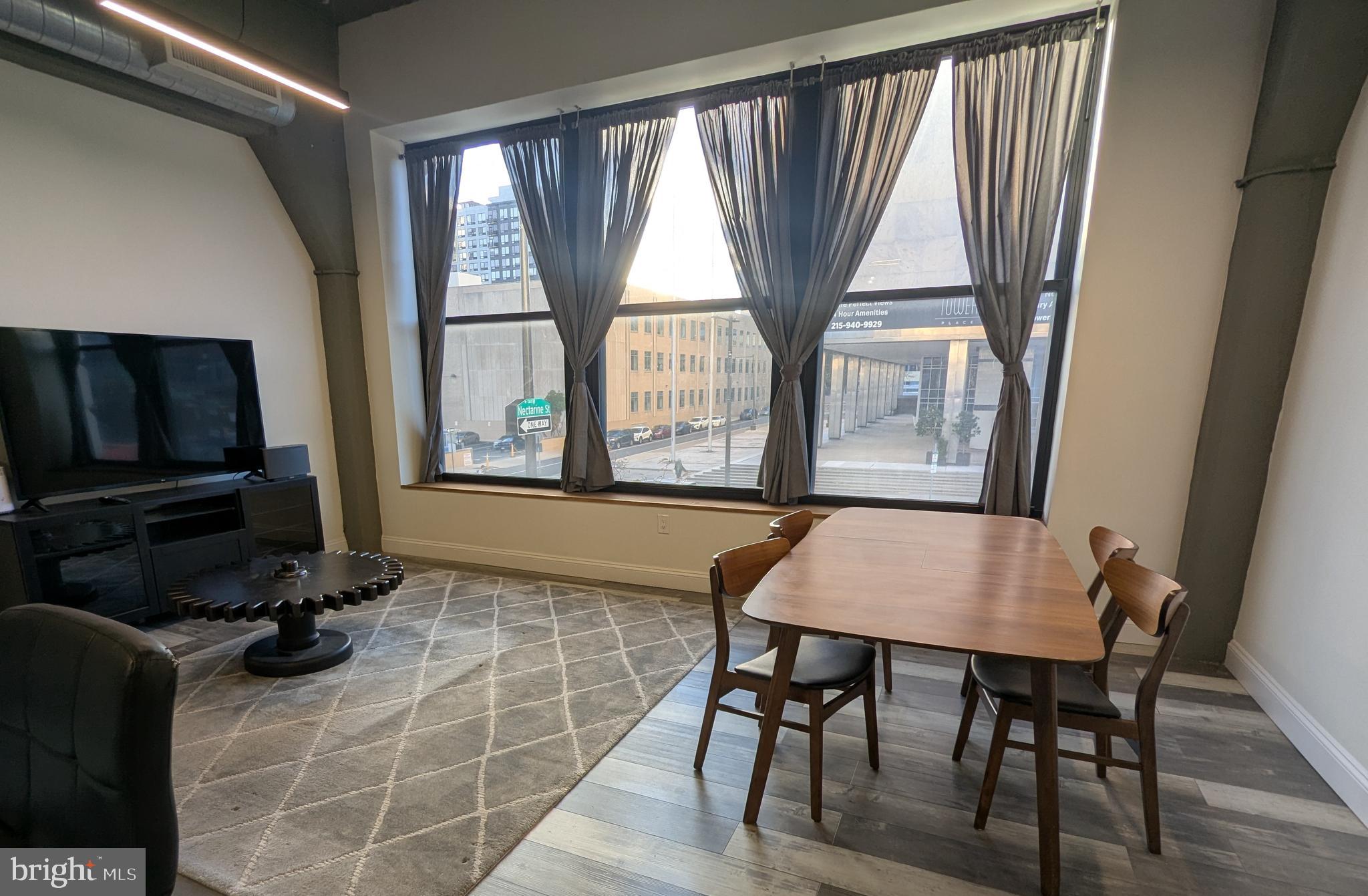 511 North Broad Street, Unit 204 Philadelphia, PA 19123 - Photo 6 of 47 a view of a dining room with furniture and a window