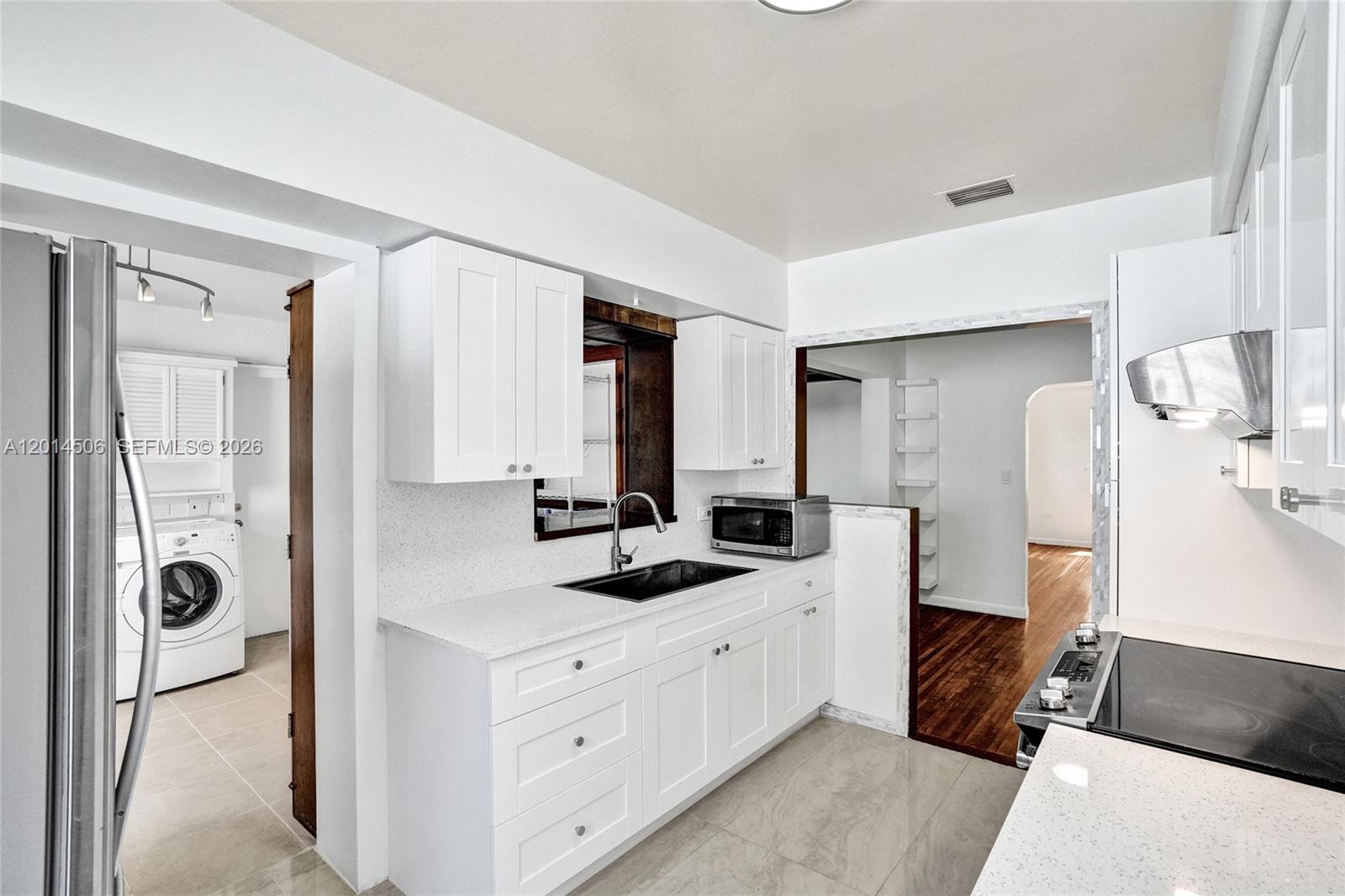 2420 Southwest 16th Street Miami, FL 33145 - Photo 11 of 35 a room with a bed and a dresser