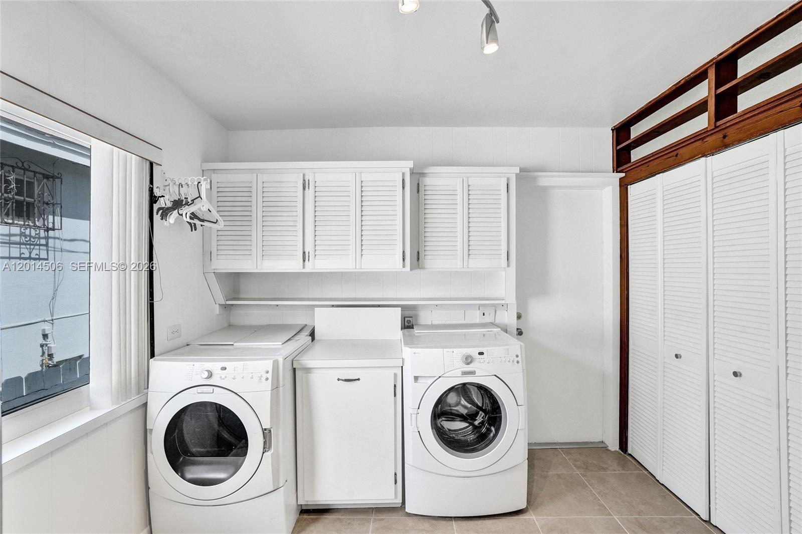 2420 Southwest 16th Street Miami, FL 33145 - Photo 13 of 35 a utility room with dryer and washer