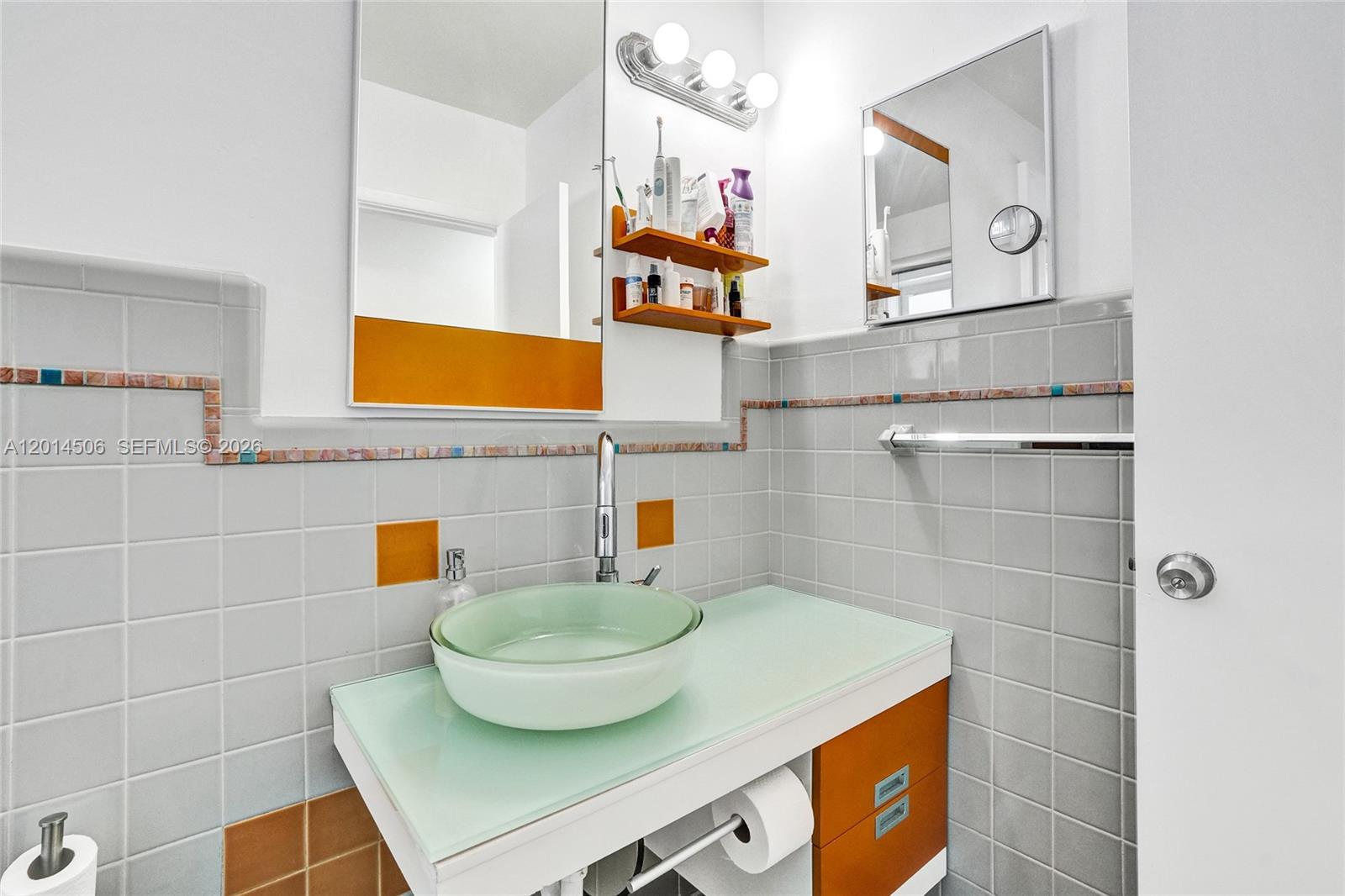 2420 Southwest 16th Street Miami, FL 33145 - Photo 22 of 35 a bathroom with a sink and a mirror