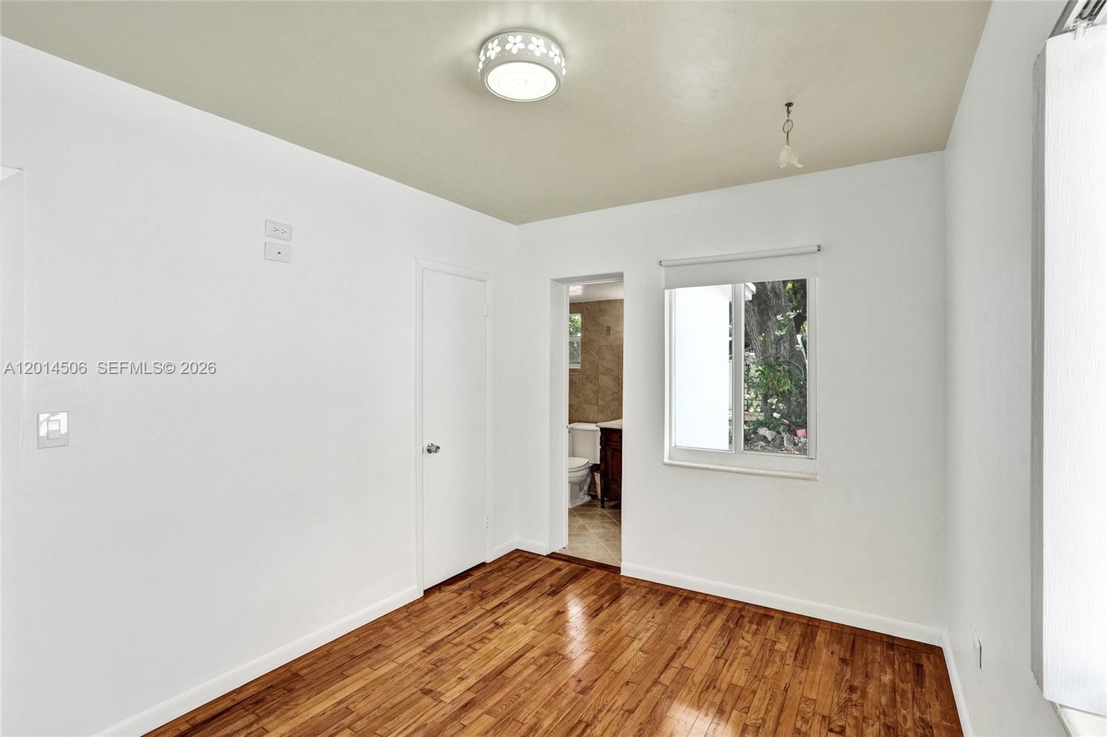 2420 Southwest 16th Street Miami, FL 33145 - Photo 24 of 35 a view of an empty room with a window