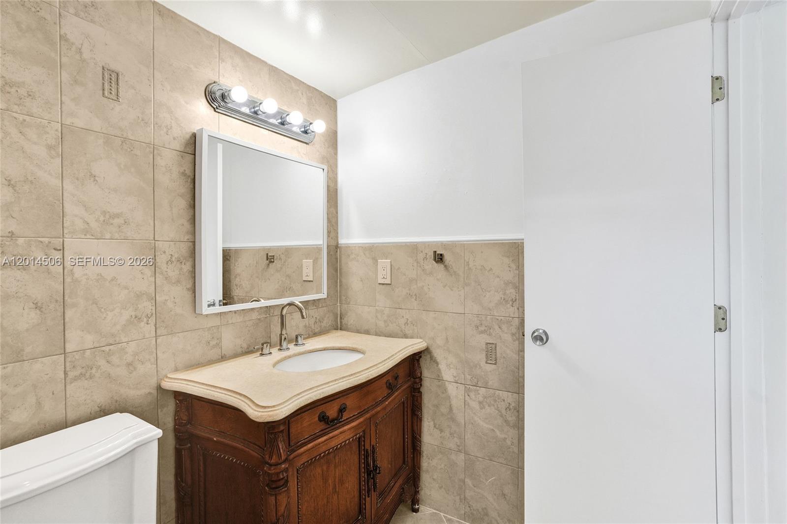 2420 Southwest 16th Street Miami, FL 33145 - Photo 26 of 35 a bathroom with a sink vanity and a mirror