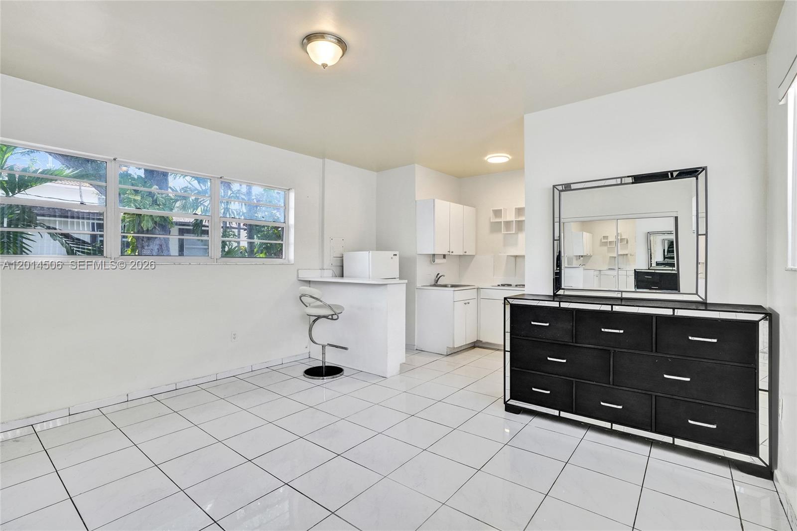 2420 Southwest 16th Street Miami, FL 33145 - Photo 32 of 35 a room with a dresser and a mirror