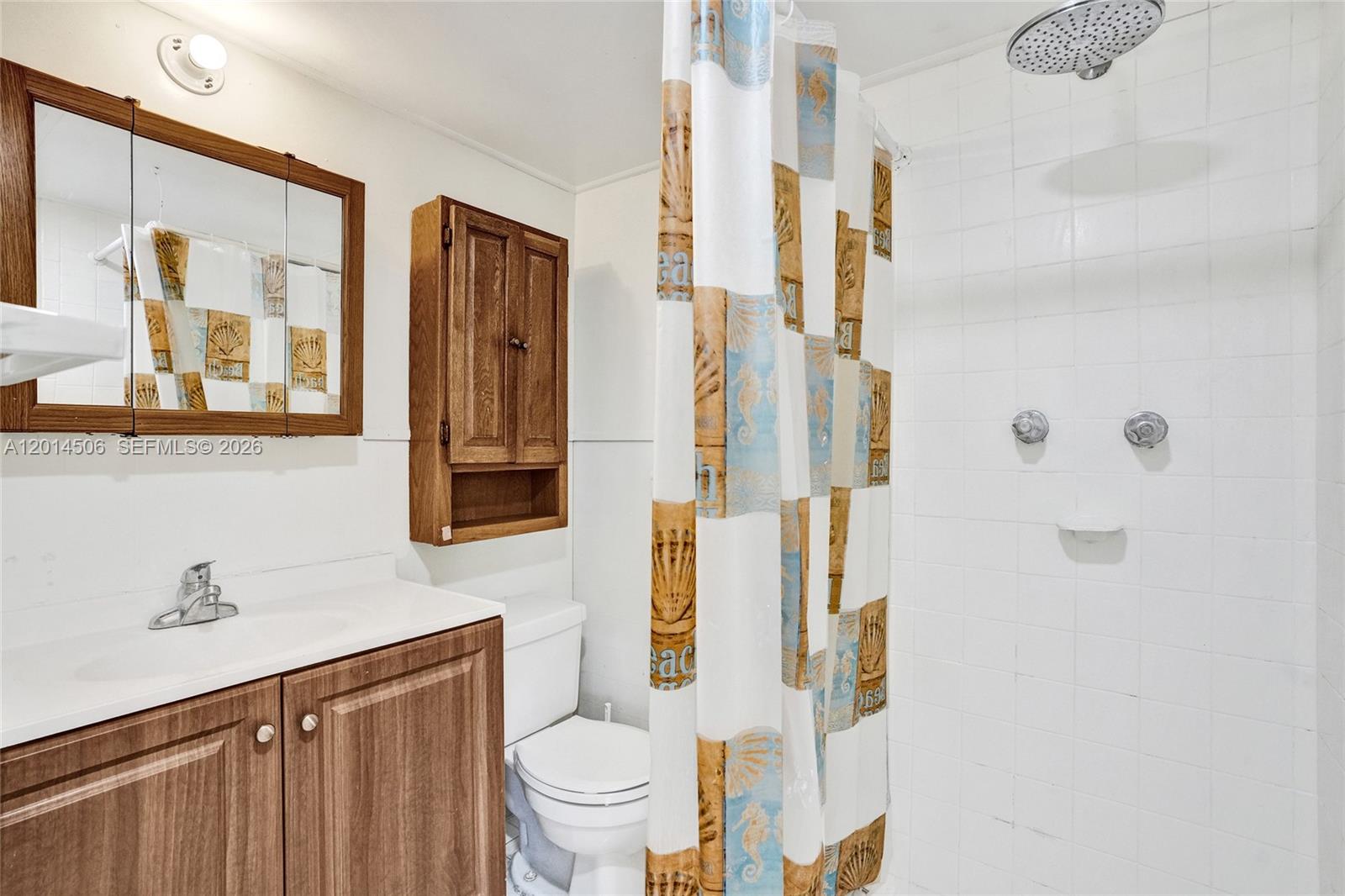 2420 Southwest 16th Street Miami, FL 33145 - Photo 34 of 35 a bathroom with a toilet sink and shower