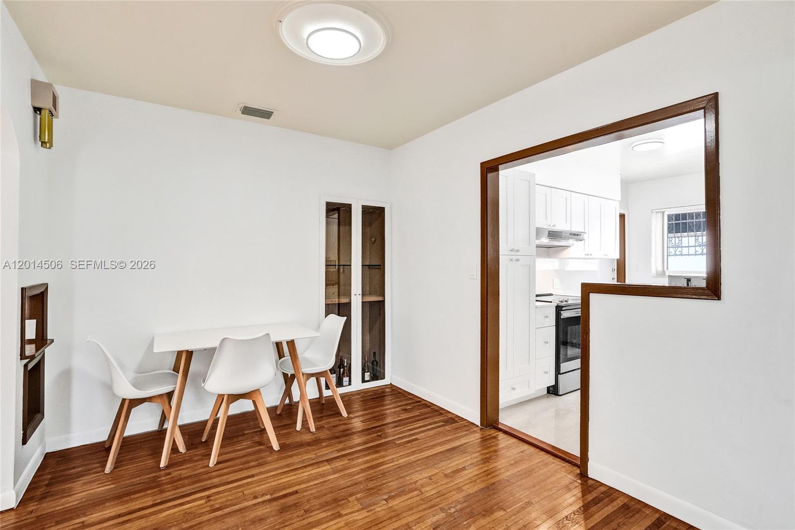 2420 Southwest 16th Street Miami, FL 33145 - Photo 8 of 35 a view of a dining room with furniture and wooden floor