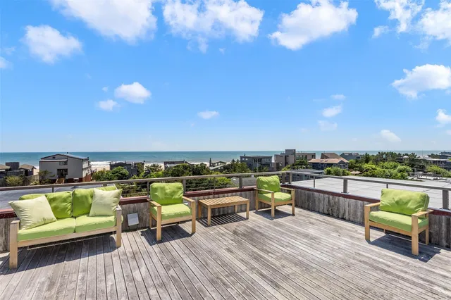 a view of roof deck with seating space