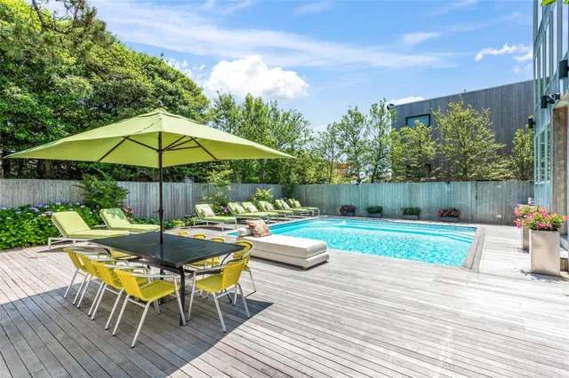 an outdoor space with furniture and umbrella