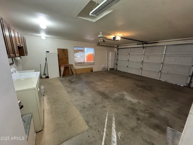 a view of room with wooden floor and furniture