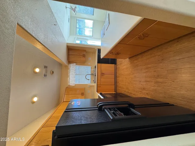 a room with a bed and a ceiling fan