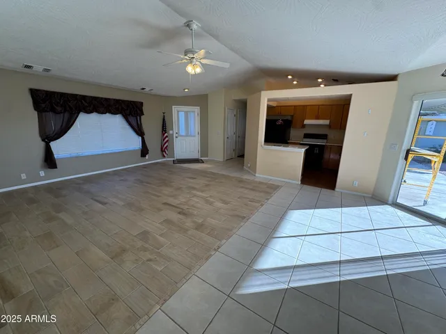 a view of an empty room with a window