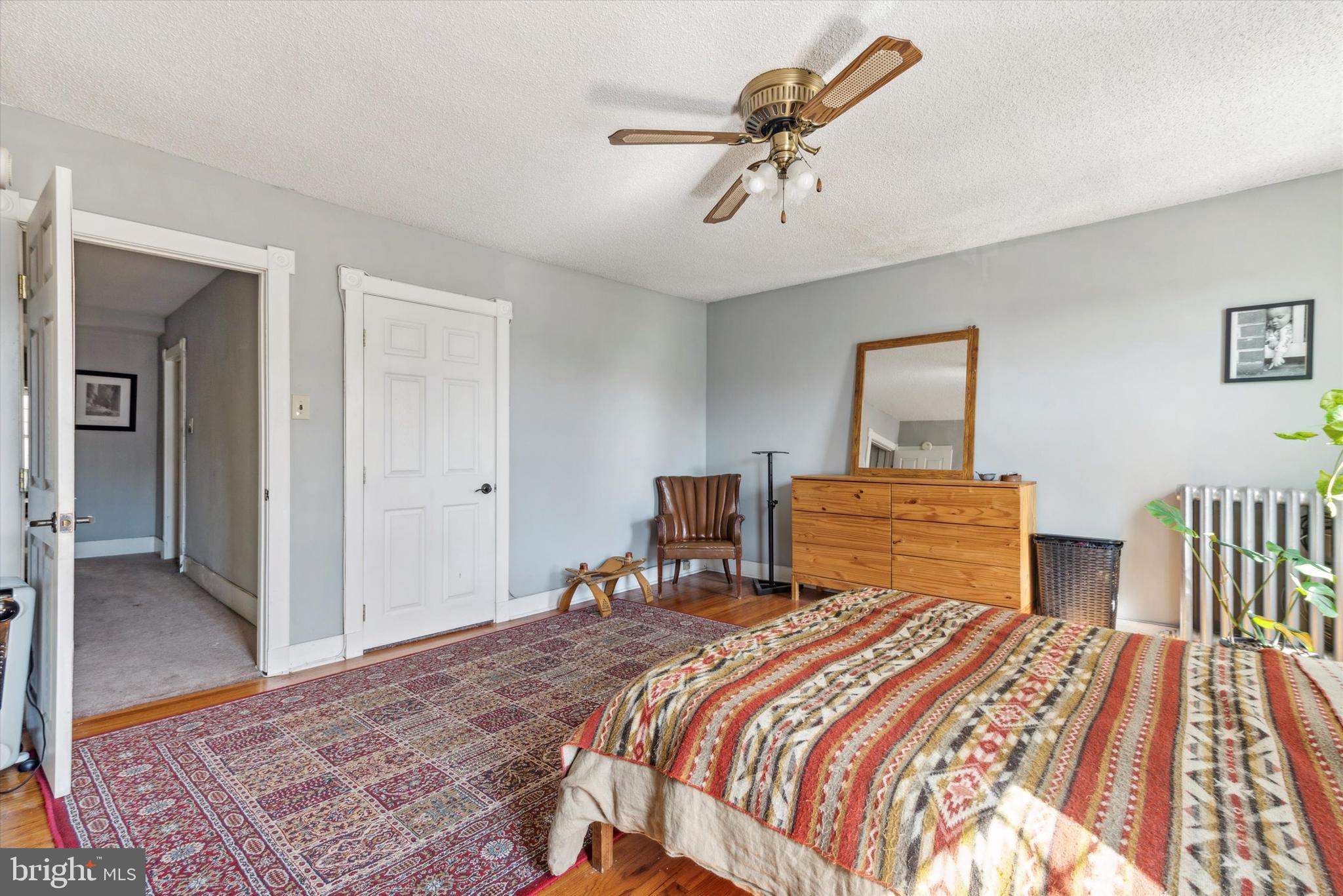 123 Kalos Street Philadelphia, PA 19128 - Photo 11 of 15 a bedroom with a large bed and a chandelier