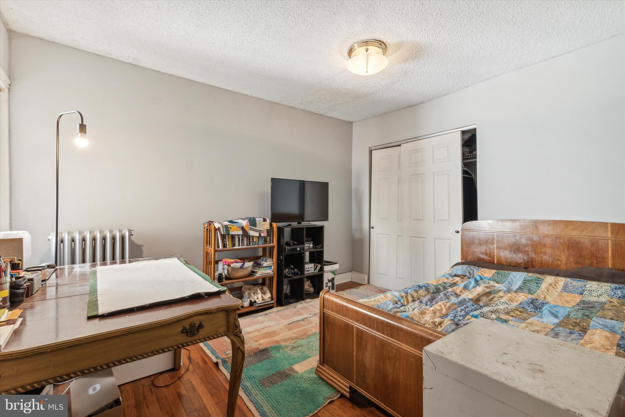 123 Kalos Street Philadelphia, PA 19128 - Photo 14 of 15 a living room with furniture and a flat screen tv