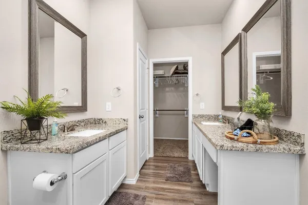 a kitchen with sink refrigerator and stove