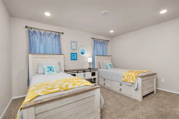 a bedroom with bed and a window