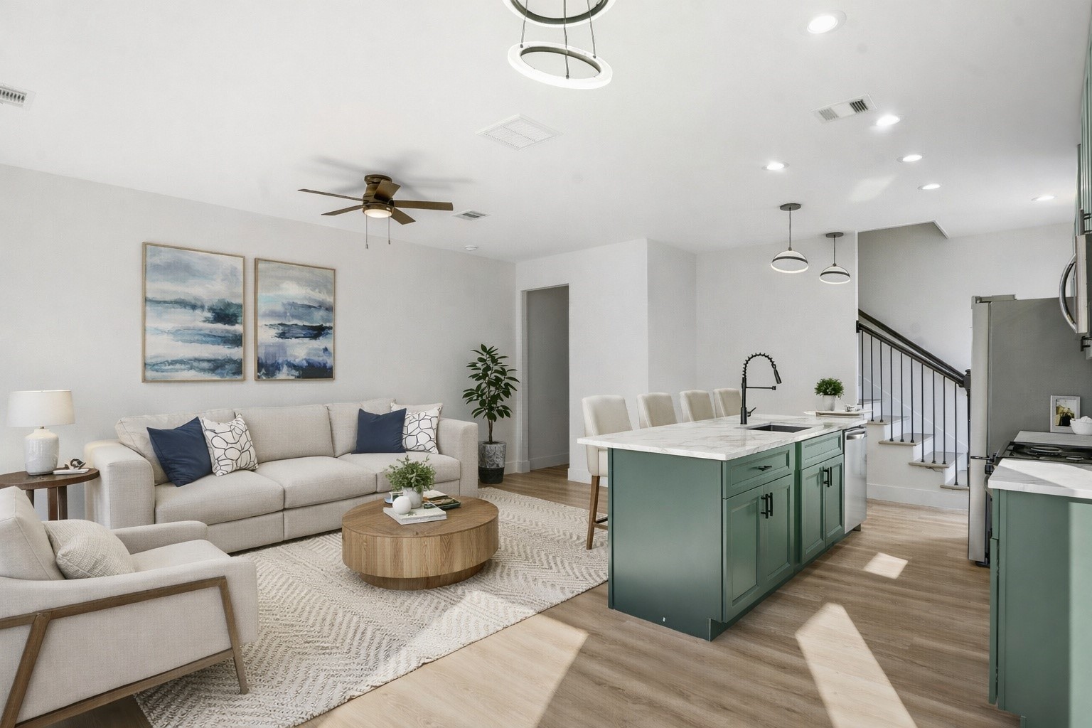 a living room with furniture and a chandelier