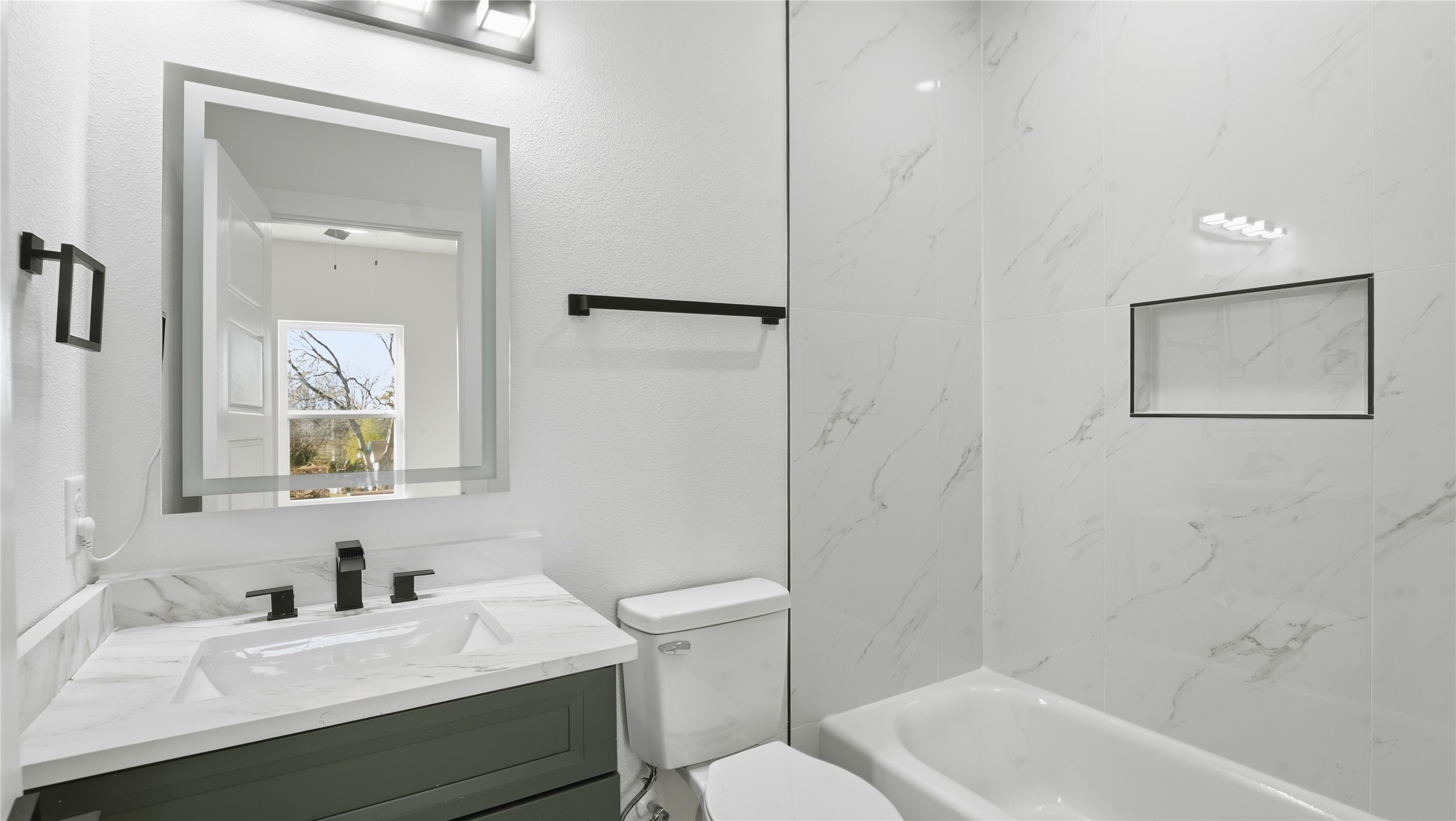 1317 Knight Street, Unit 1 Houston, TX 77022 - Photo 11 of 11 a bathroom with a sink a toilet and shower