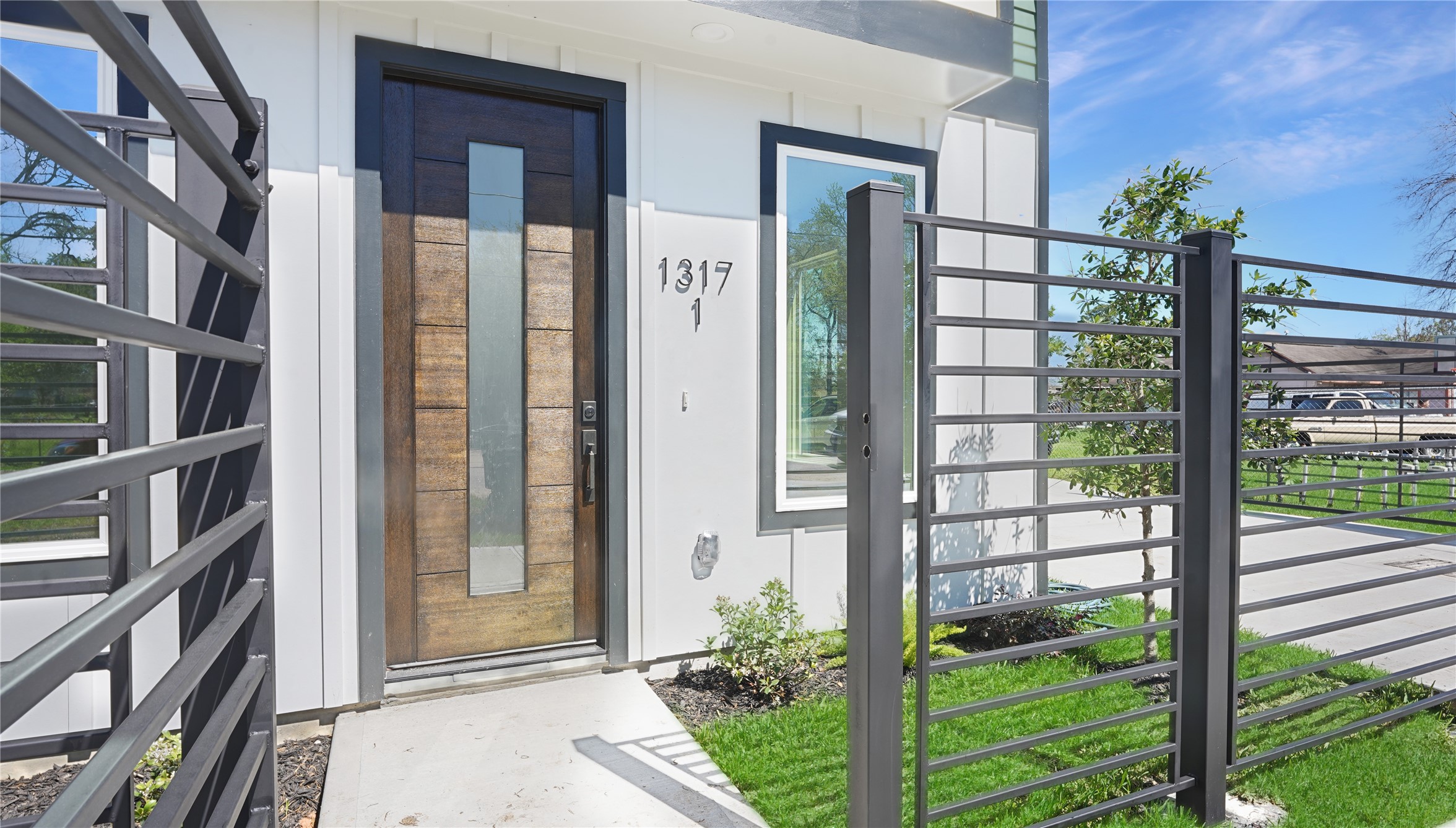 1317 Knight Street, Unit 1 Houston, TX 77022 - Photo 2 of 11 a front view of a house with a garden