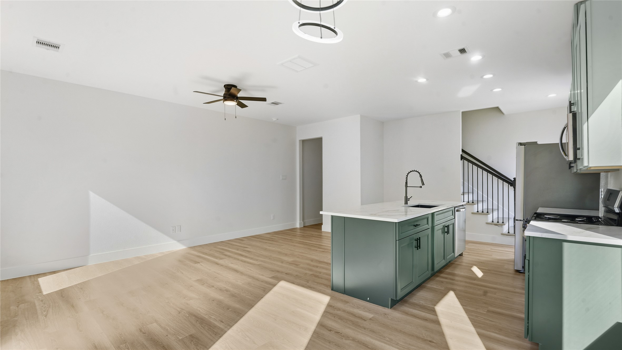 1317 Knight Street, Unit 1 Houston, TX 77022 - Photo 7 of 11 a kitchen with stainless steel appliances granite countertop a sink and a stove