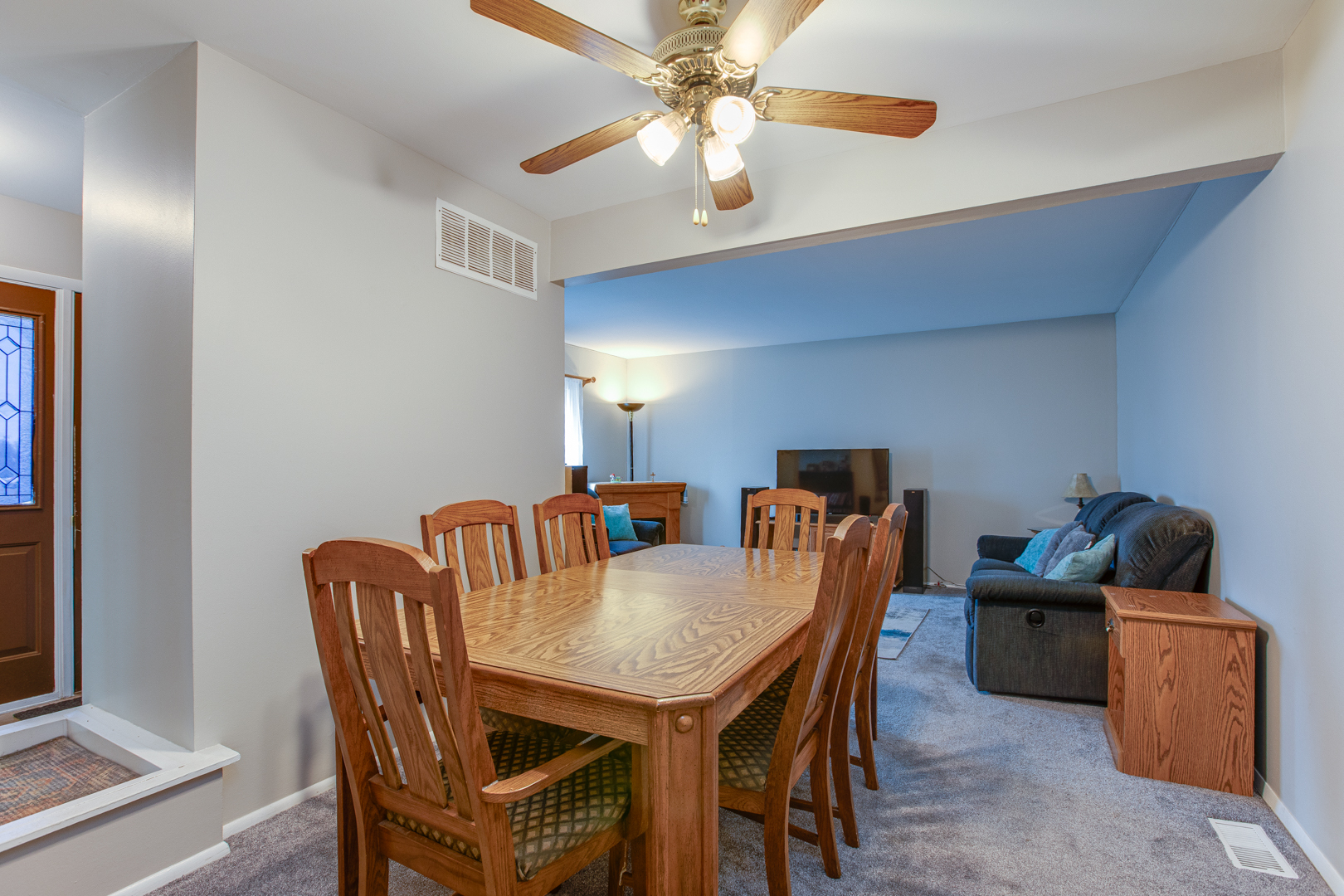 7315 Winthrop Way, Unit 6 Downers Grove, IL 60516 - Photo 4 of 11 a dining room with furniture and chandelier