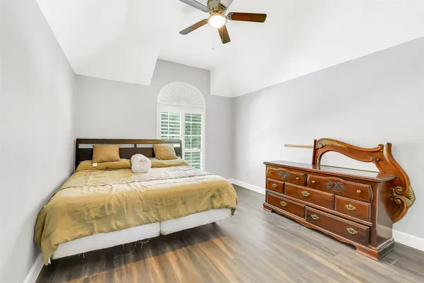 a bedroom with a bed and window