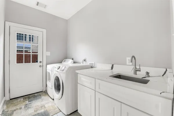 a utility room with dryer and washer